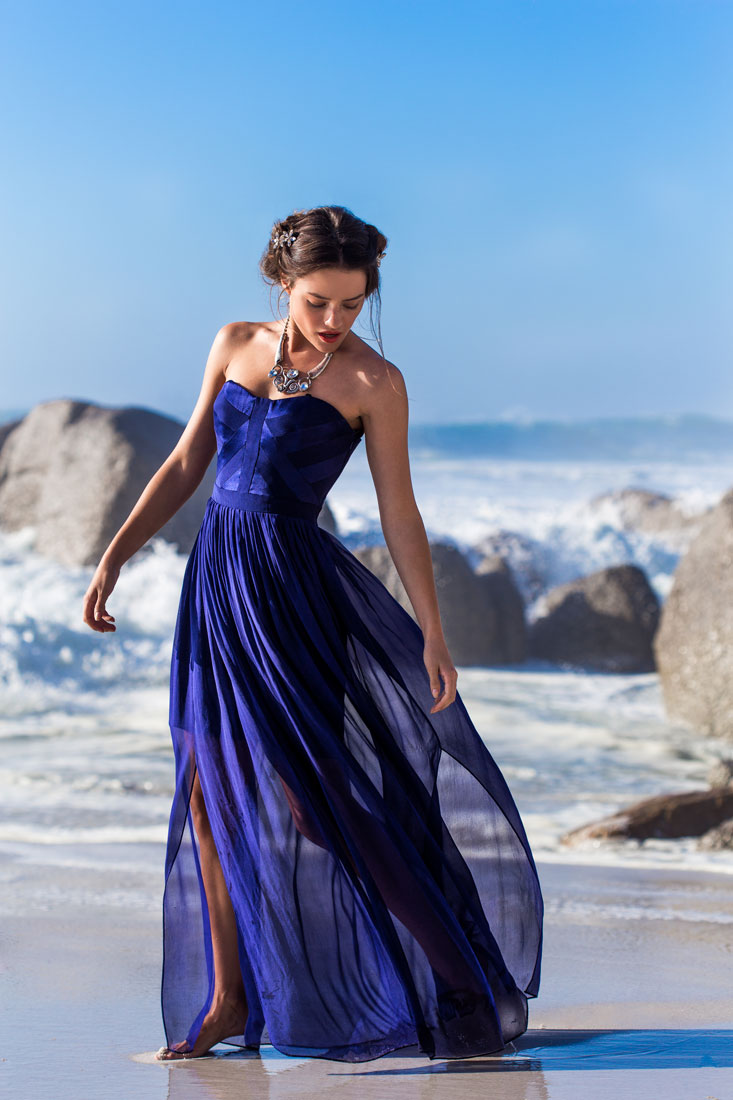 fashion model in blue dress on the beach in cape town